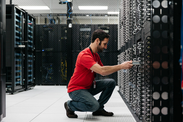 A Hivelocity employee installing a server into a rack