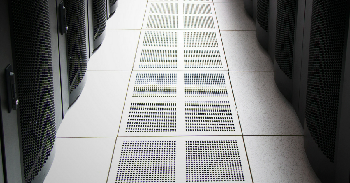 Cooling vents in the floor beneath rows of server cabinets
