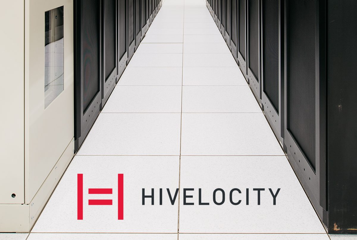Two rows of server cabinets and the Hivelocity logo
