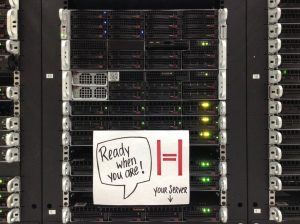 server rack with a sticker saying "Your server is ready when you are"