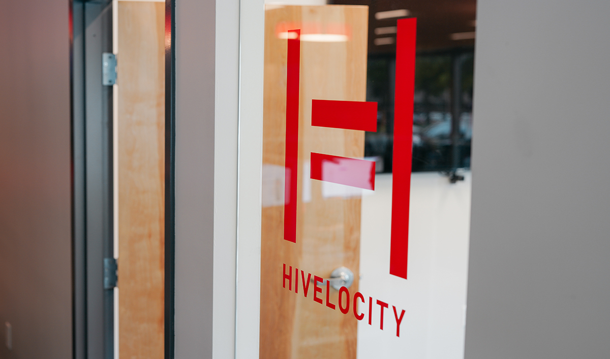 A windows featuring a decal of the Hivelocity logo