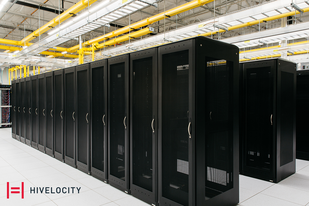 The Hivelocity logo next to rows of server cages ready to be filled