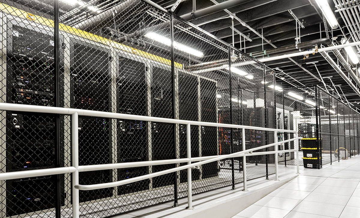 Interior of a Hivelocity data center showing rows of server cabinets in secure cages